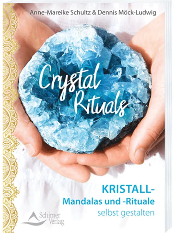 Das weiße Buch "Crystel Rituals" mit einem blauen Kristall auf dem Cover von Anne-Mareike Schultz und Dennis Möck-Ludwig